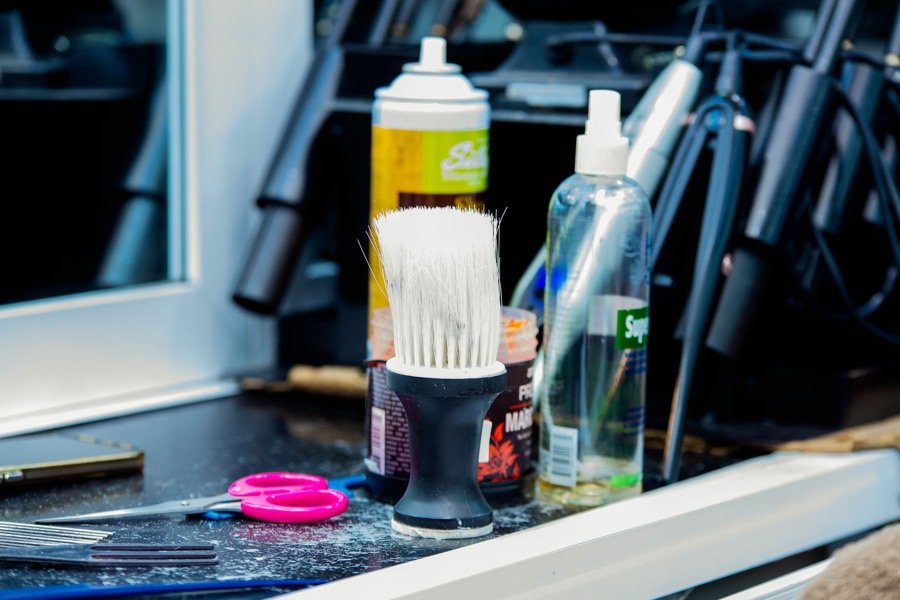 Shampoo and conditioner bottles at a wash station